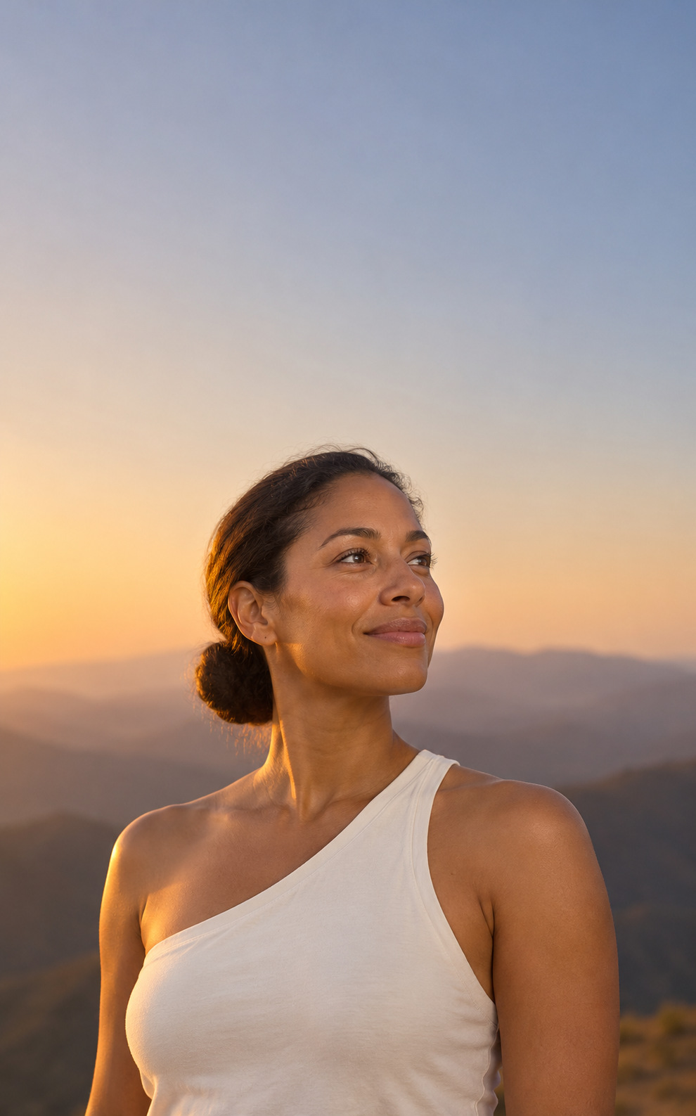 A woman outdoors in warm evening light