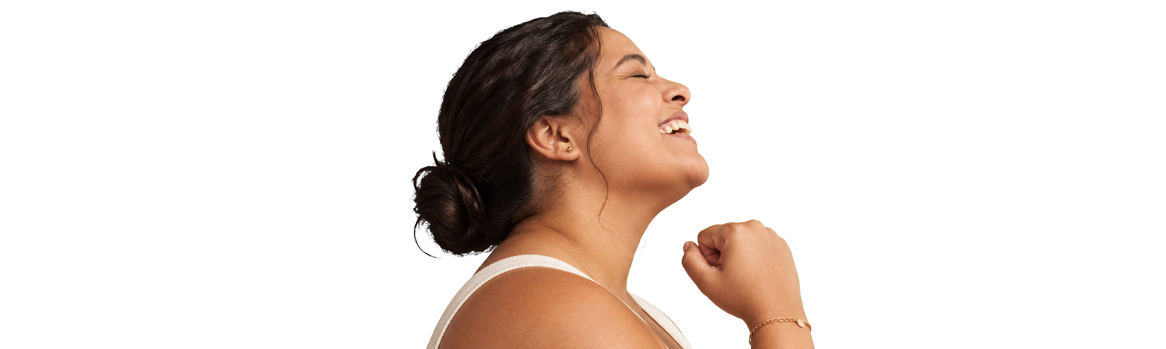 A woman laughing with her fist raised in celebration